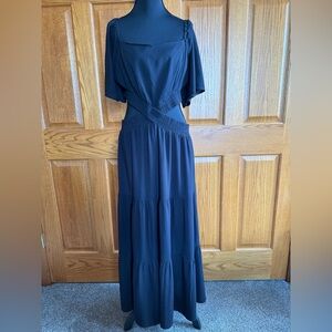 A black maxi cutout dress by Leani, size X-Large.